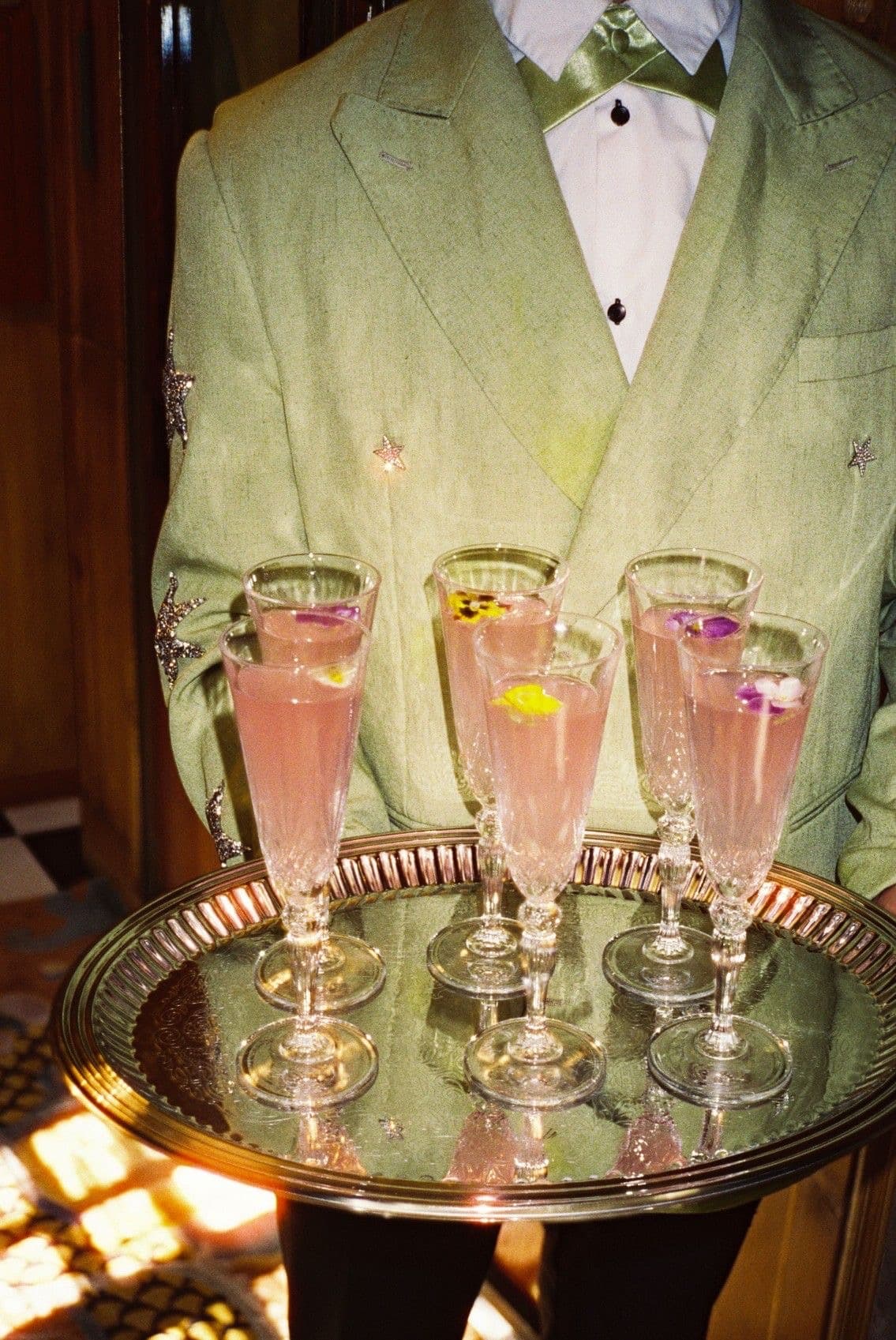 Sage green suit with drinks